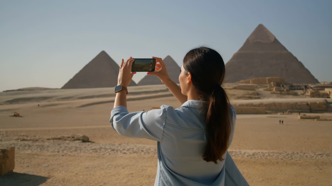 Woman Takes Photo of the Giza Pyramids in Egypt