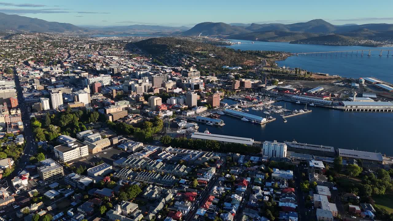 Panoramic aerial footage of the city of Hobart with harbour and surrounding landscapes.