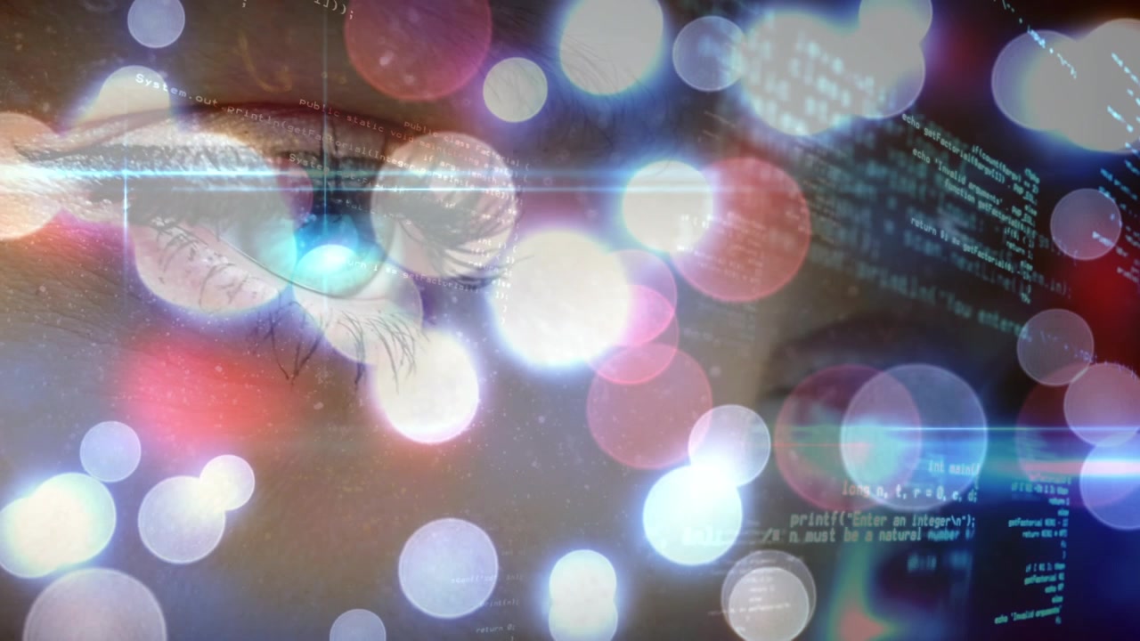 Close-up of Human Eye Overlaid with Digital Programming Code and Bokeh Lights