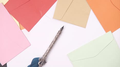 colorful envelopes and a vintage fountain pen