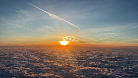 a pilot unique point of view: sunrise over a sea of clouds