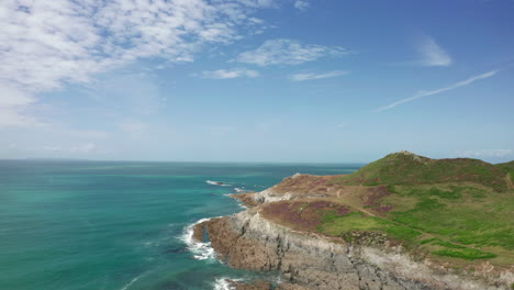 aerial flyover of a coastal peninsula in north devon on a summer’s day