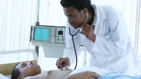 afroamerican doctor listening with a stethoscope to patients lungs