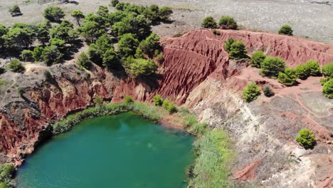 Drone-slowly-zoom-above-Cava-di-Bauxite-in-Salento,-Puglia