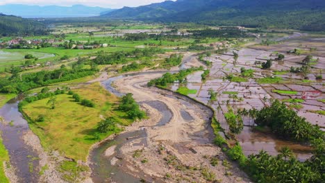 murky shallow river near quarry area on farmland in southern leyte, philippines