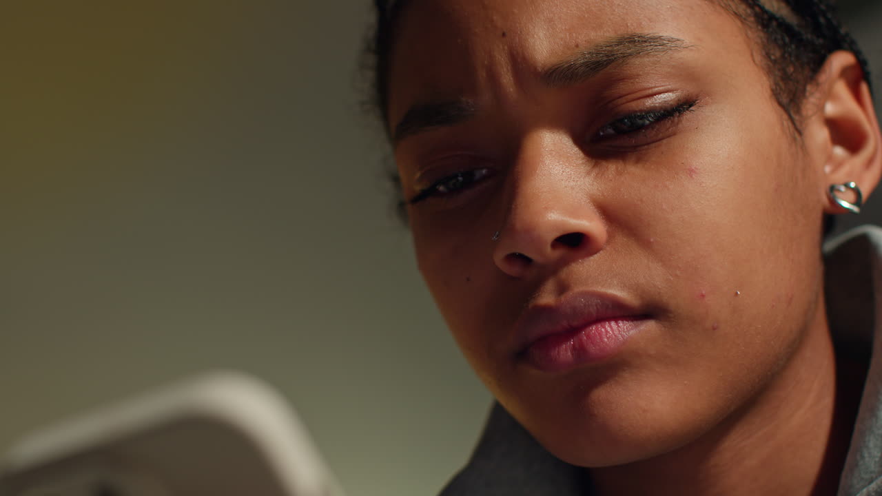 Close-up of a Person Concentrating on a Device