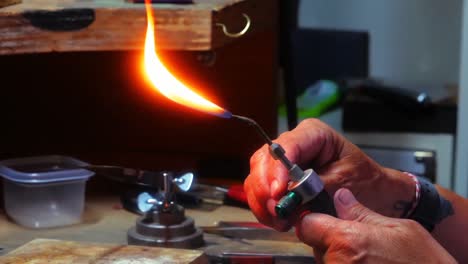 craftswoman using blowtorch