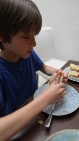 boy eating pancakes