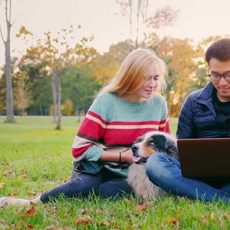 Friends-Relaxing-On-The-Lawn-In-The-Park-5