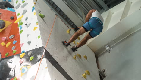 man in a climbing wall centre