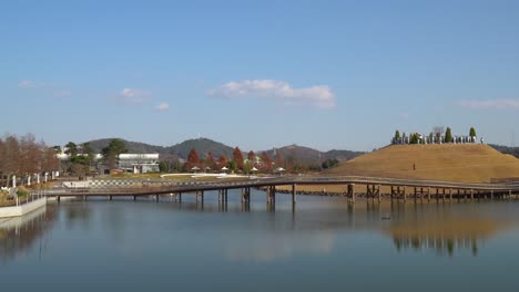 suncheonman bay lake garden - visitors walking on bonghwa hill spiral walkway trails and bridge of dreams, suncheon, jeonnam, south korea