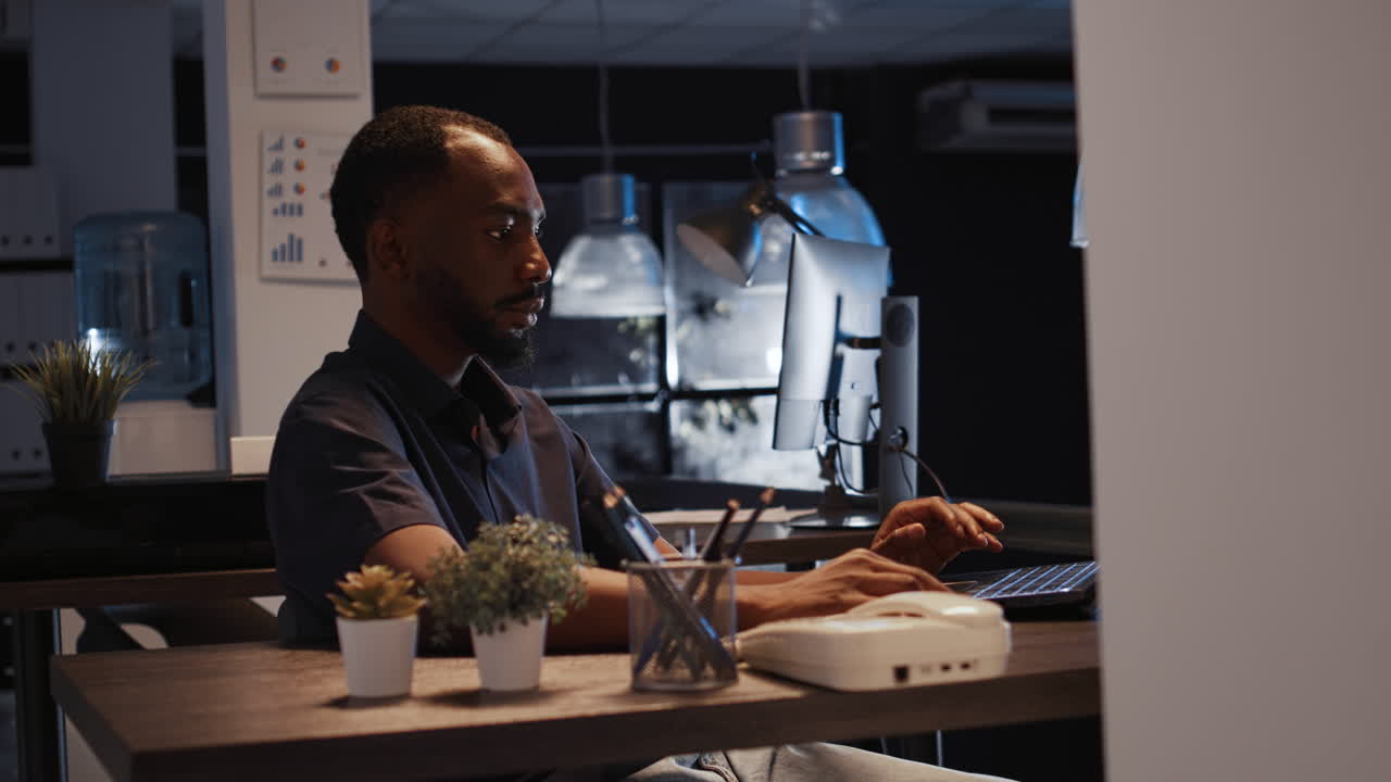 Office worker analyzing startup data on laptop to create project