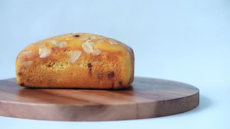 almond chocolate chip loaf cake on wooden board