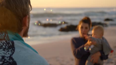 family having fun in the beach 4k