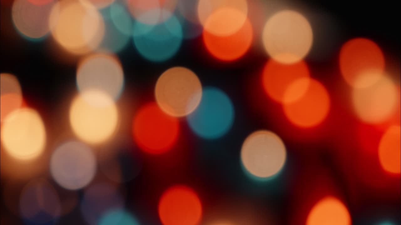 Colorful Bokeh Lights Shifting and Blurring on a Dark Background