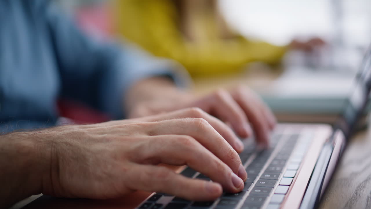 Successful colleagues working computers at open space closeup. Smiling manager