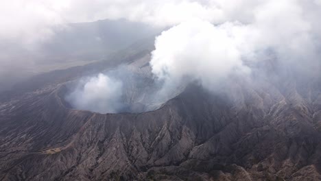 eruption of mount bromo from above the clouds