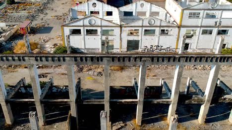 Aerial-view-of-the-ruins-of-the-old-abandoned-cement-factory-Guadalquivir,-Seville,-Spain---drone-shot