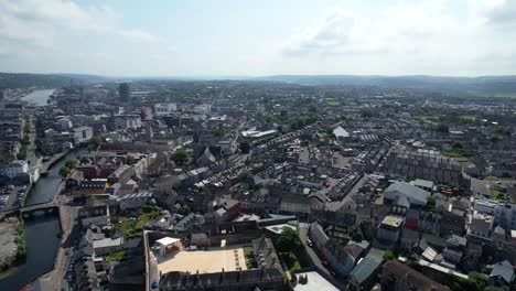 Aerial-panning-left-shot-of-Cork-city-centre-with-Lee-River-in-the-middle,-Ireland