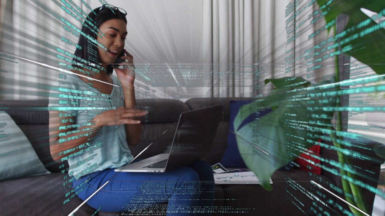 Woman using laptop while on phone on sofa causing teal overlay crossing face showing business data