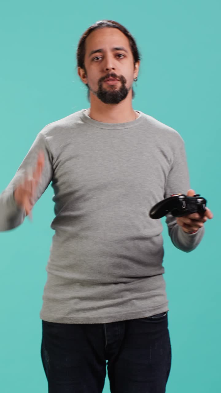Vertical video Portrait of gamer annoyed after losing online multiplayer videogame