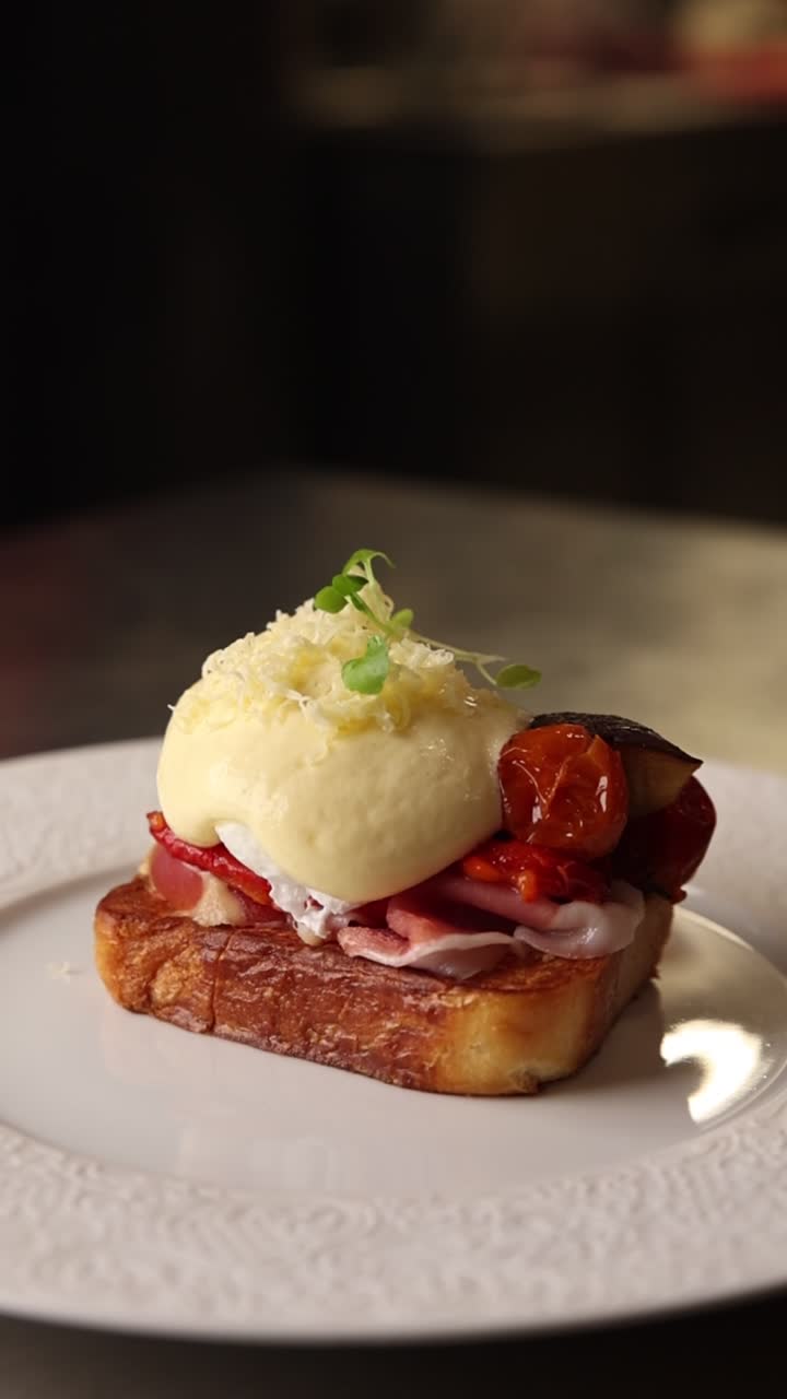Hand Garnishing Gourmet Breakfast Toast with Microgreens
