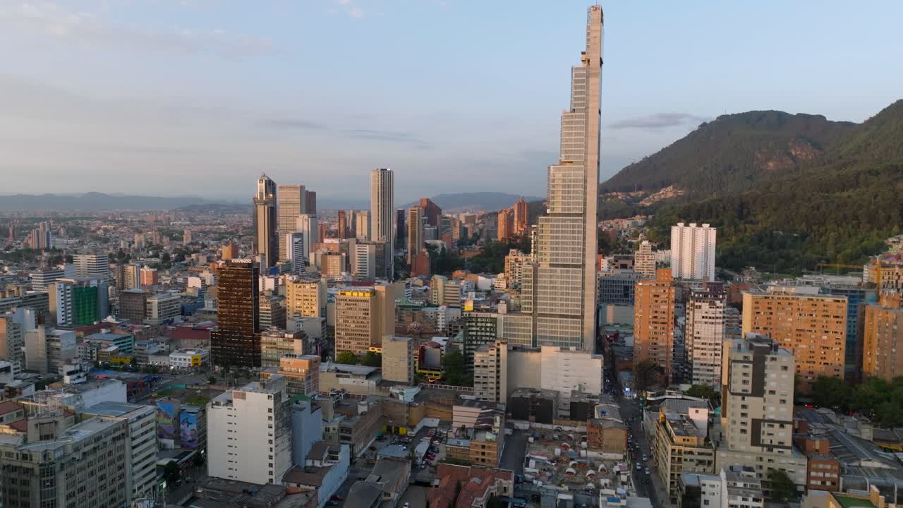 Drone shot over Bogota business city center at sunset