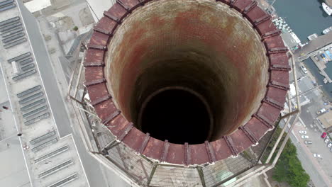 Aerial-Dolly-Over-Top-Of-Smokestack-At-Morro-Bay-Power-Plant-With-Birds-Eye-View-Down