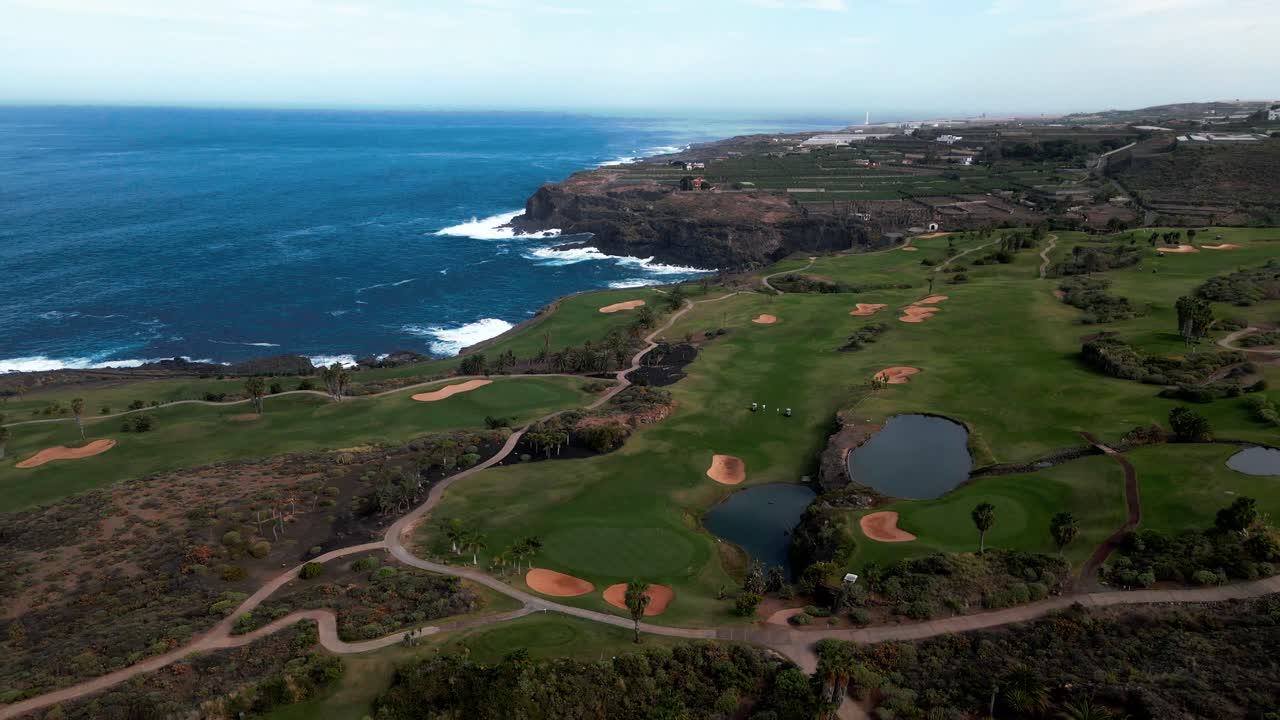 Green Picturesque Golf Course Right Beside Rocky Cliffs Overlooking Beautiful Blue Sea