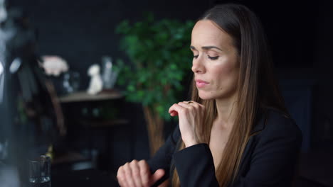 Businesswoman-thinking-about-work-in-office.-Lady-holding-hands-at-face