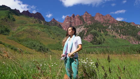 hiking trail following women female model actress wind blowing hair maroon bells 14er red peaks capital wilderness aspen snowmass rocky mountain colorado summer stunning morning cinematic follow