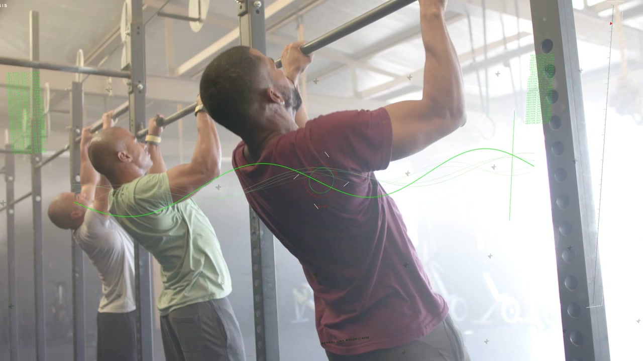 Three men doing pull-ups in gym, starting reaching up, gripping bars, pulling chins for strength
