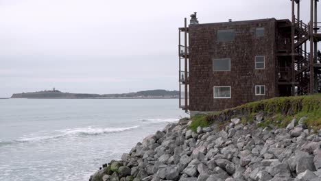 old apartment on the edge of the shore and the pillar point