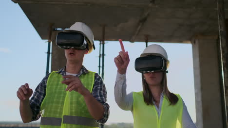 the main engineers of the factory carrying vr headset designs the building being on the building site. virtual mixed reality applications