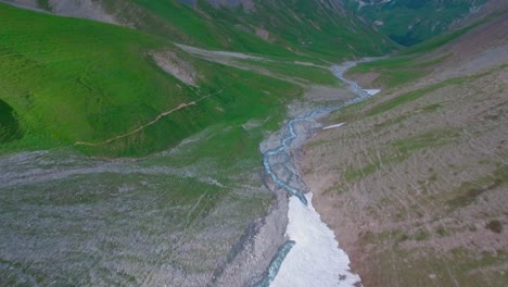 Drone shot above the French Alps in early summer 7