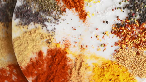 a variety of spices on a table in studio