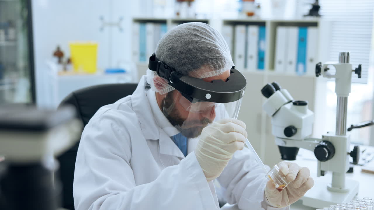 Focused Scientist Conducting Experiment with Samples in Lab