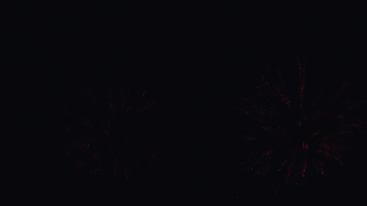 Real fireworks exploding celebration frame fill and loop seamlessly abstract blur bokeh lights in the night sky with the glowing fireworks show festival