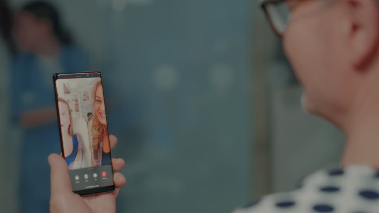 Senior patient with sickness talking on videocall with family