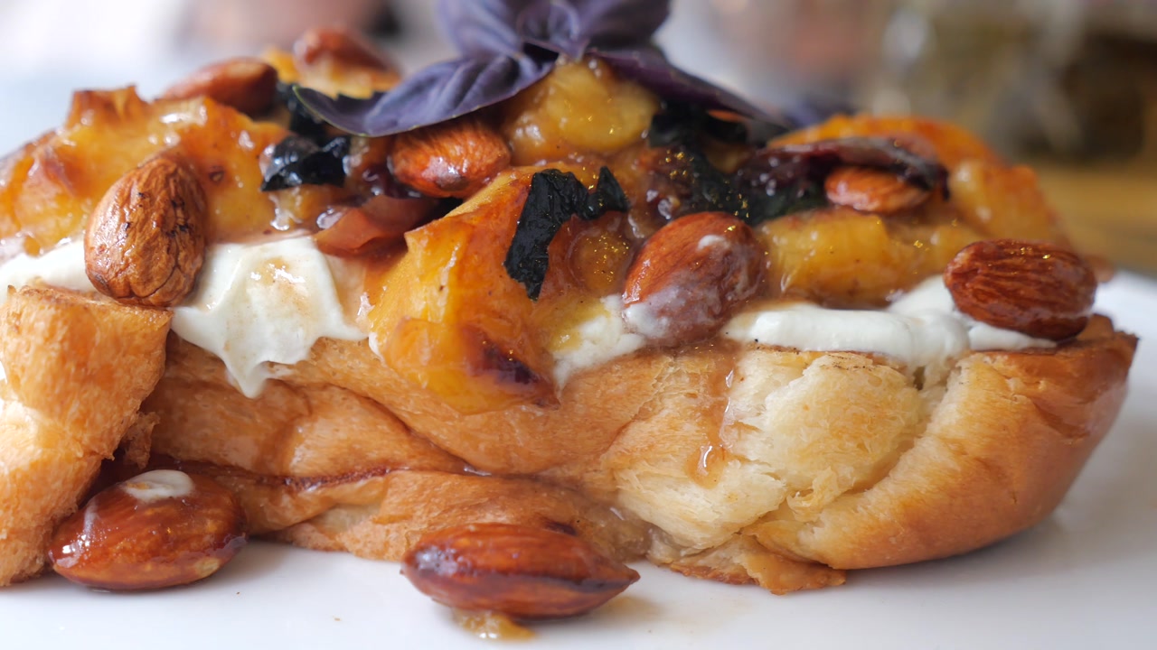 Gourmet Peach and Almond Dessert with Cream and Syrup
