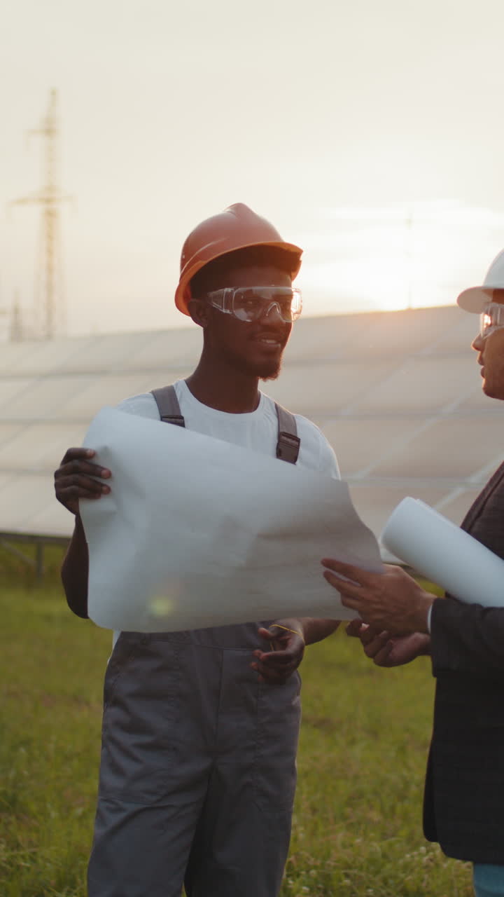 Engineer reviewing blueprints