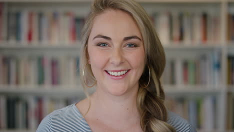 portrait happy young blonde woman student smiling enjoying relaxed lifestyle independent female in library bookstore background close up
