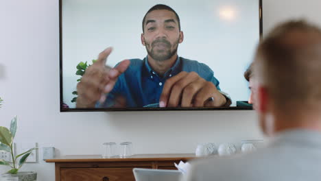 group of business people having conference call meeting in boardroom team leader man chatting to colleagues using online video chat on tv screen discussing ideas in office 4k