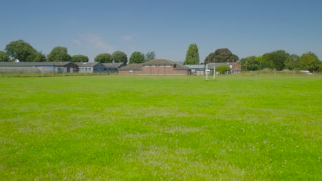 grassy football pitch in the vicinity of school in harwich, essex, england