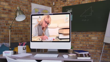 Caucasian-female-student-learning-on-computer-screen-during-video-call