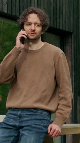 man talking on phone outdoors