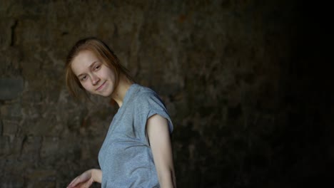 a teenage girl dances in the shade