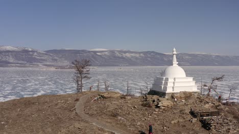 ritual bypassing pilgrims around the buddhist shrine of the stupa of enlightenment.