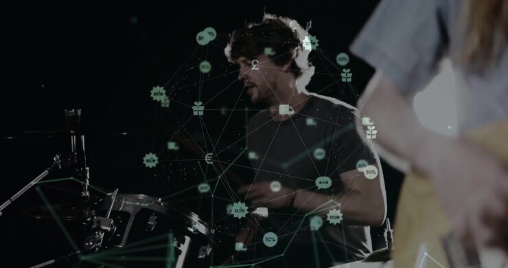 Guitarist strumming pulsing network overlay while drummer playing drum kit for music production