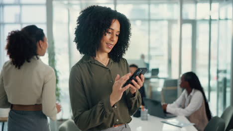business woman texting in an office